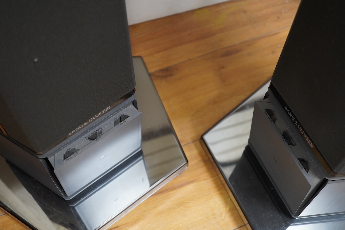 A Bang and Olufsen 6500 hi-fi system, comprising of a Beocord 6500, a Beogram CD 6500, a Beomaster 6500, and a master control panel, together with a pair of floor standing pedestal speakers, 164cm high, and pair of type